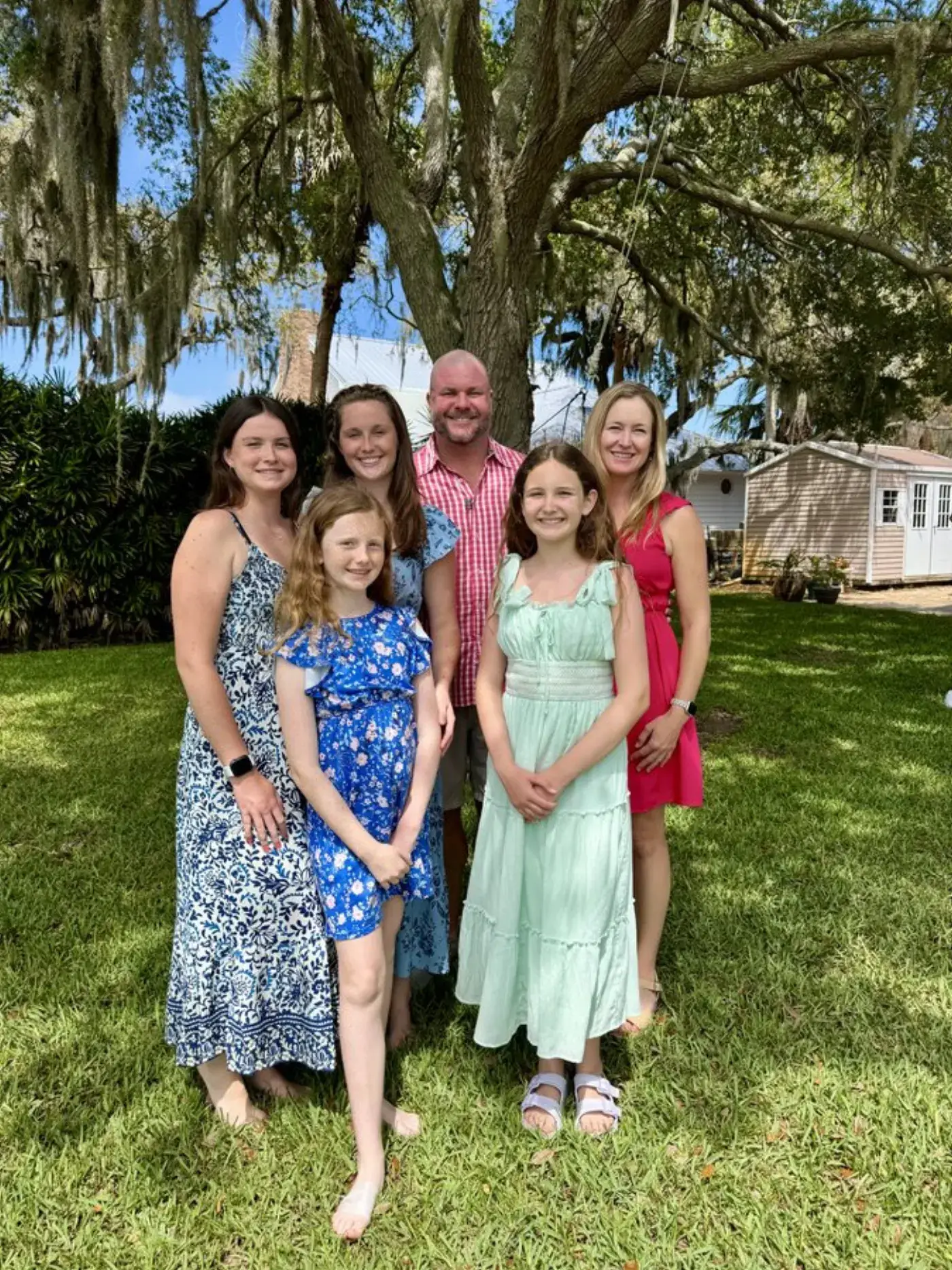 The Street family standing beneath a Spanish-moss-draped oak on a sunny afternoon in Florida